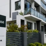 Modern Australian apartment building with a For Lease sign in the foreground, reflecting rental pressure and housing affordability concerns.
